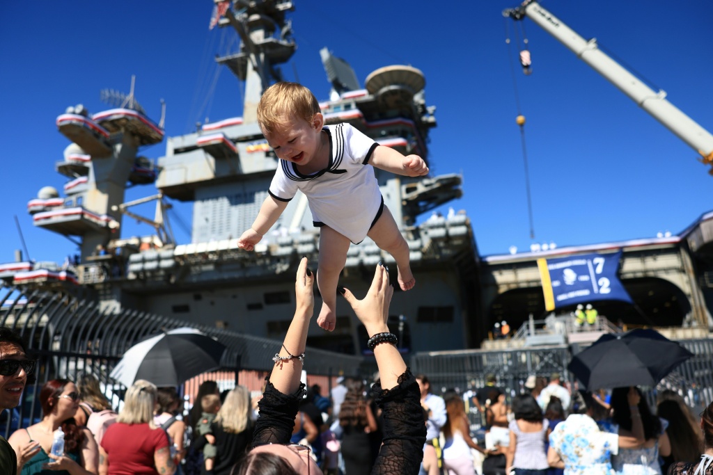 Families welcomed back service members aboard the USS Abraham Lincoln when it returned to its home port of San Diego after almost a year away — David Swanson / AFP