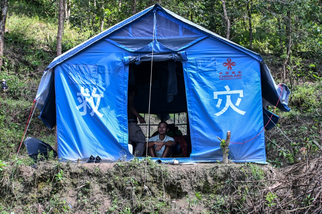 Government report shows that more than 7,500 private houses were damaged in the floods, leaving many to live in tents — Prakash MATHEMA / AFP