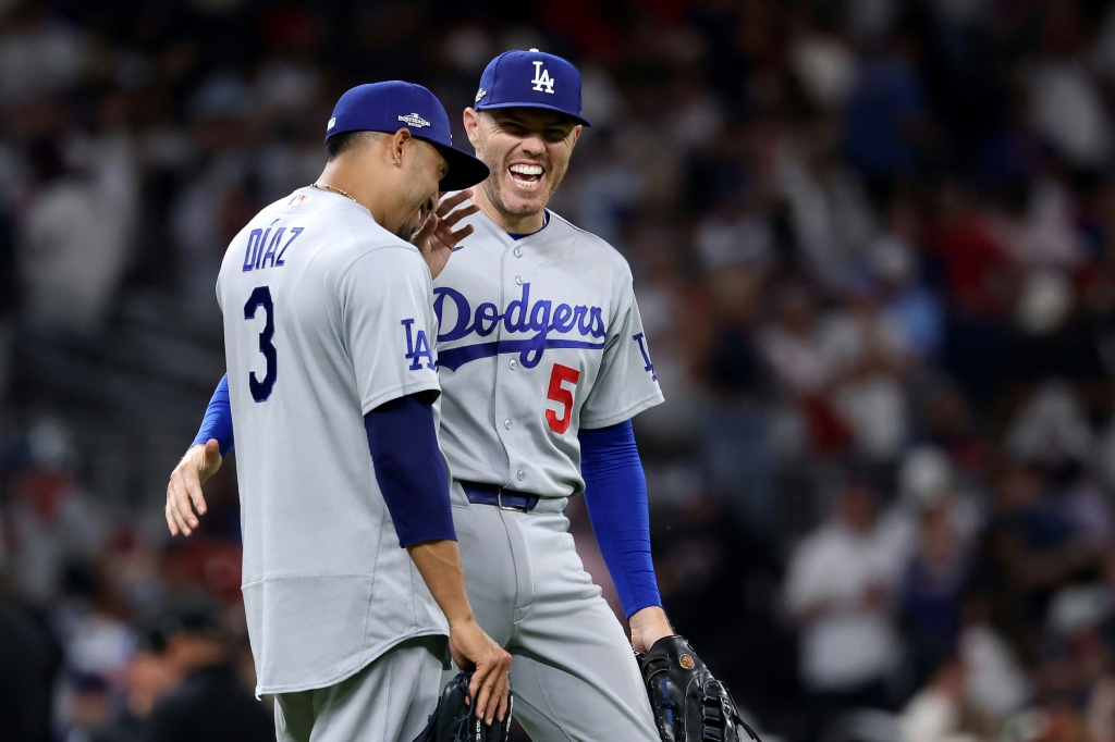 Three-peat bid on track: Edwin Diaz and Freddie Freeman are all smiles after the Los Angeles Dodgers' victory over the Atlanta Braves in the National League division series — Kevin C. Cox