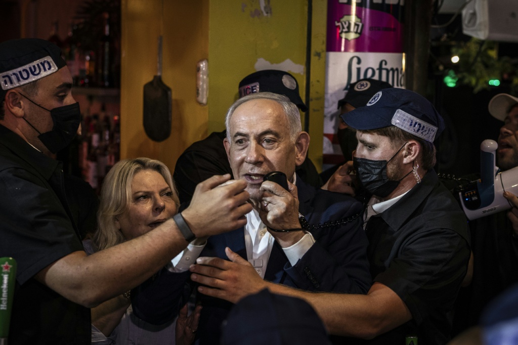 Israeli Prime Minister Benjamin Netanyahu speaks in Ben Yehuda Market during a campaign visit in Jerusalem on October 22, 2026 — JOHN WESSELS / AFP