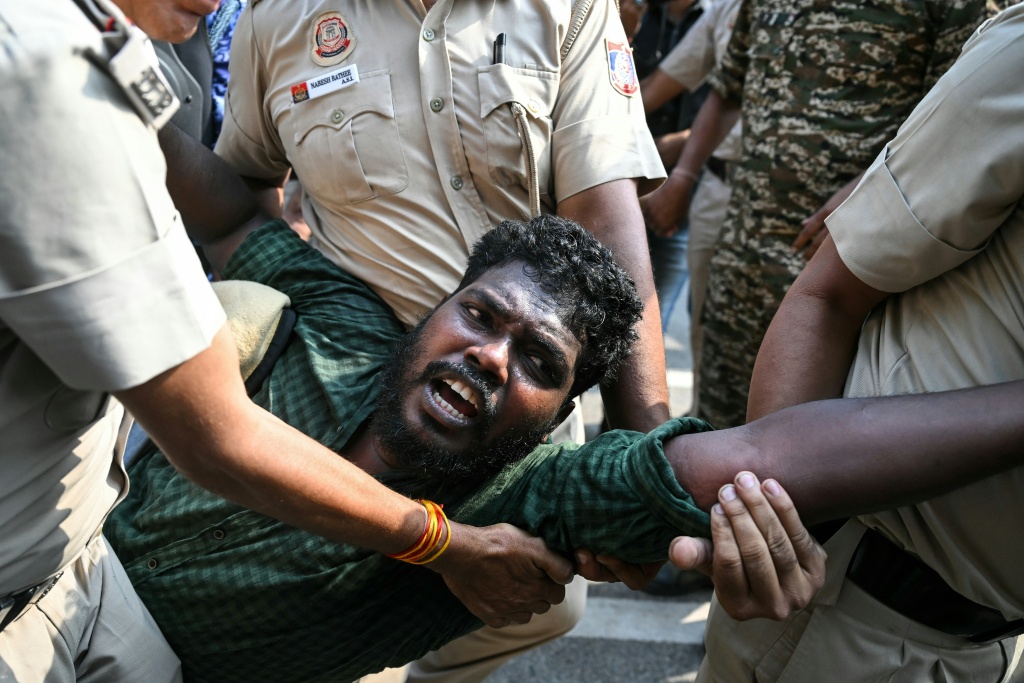 Security forces detain a student activist during a protest in New Delhi — Arun SANKAR / AFP