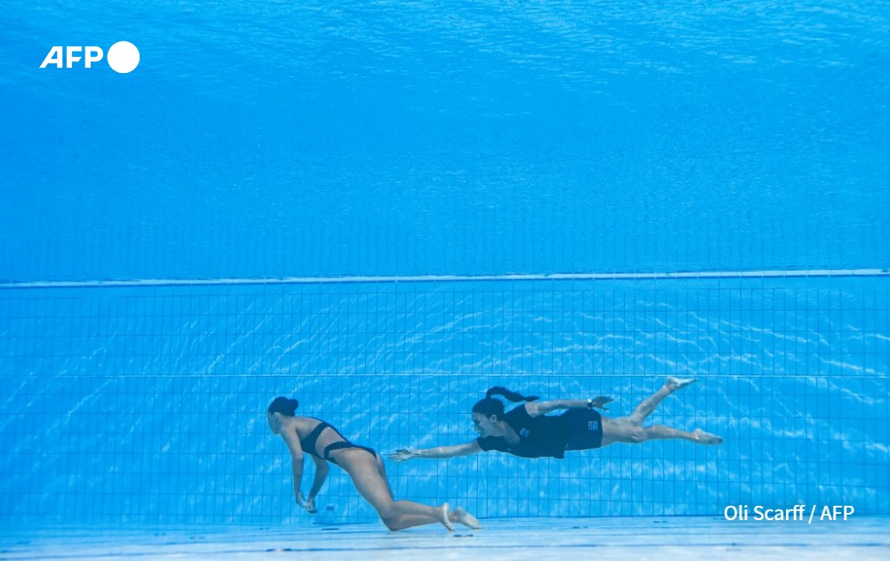 Oli Scaff picture of USA's coach Andrea Fuentes recovering swimmer Anita Alvarez, from the bottom of the pool during an incident in the women's solo free artistic swimming finals during the Budapest 2022 World Aquatics Championships at the Alfred Hajos Swimming Complex in Budapest, Hungary on June 22, 2022.
