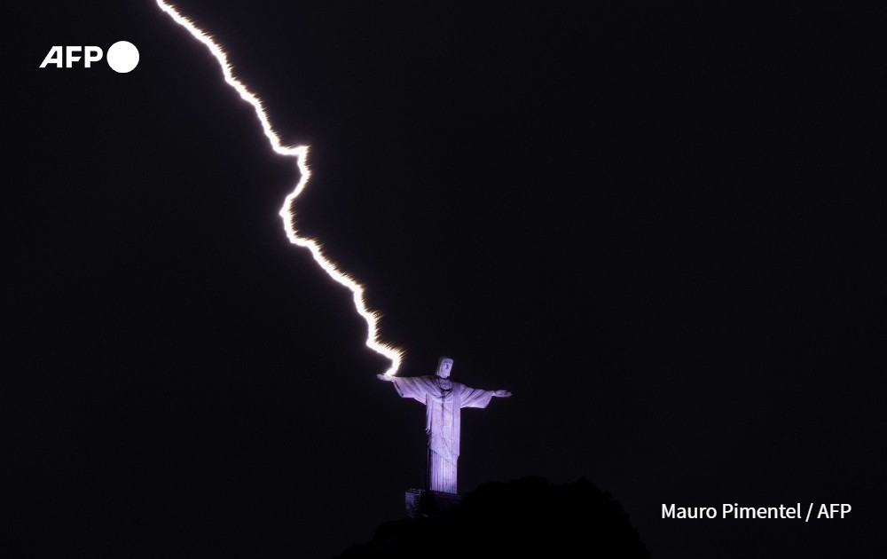 lightning hits hand of Christ the Redeemer, Rio de Janeiro, Brazil