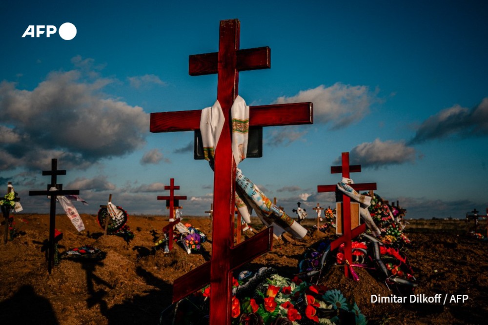 Memorial crosses are seen on the new graves at a cemetery in the southern city of Kherson on December 28, 2022.