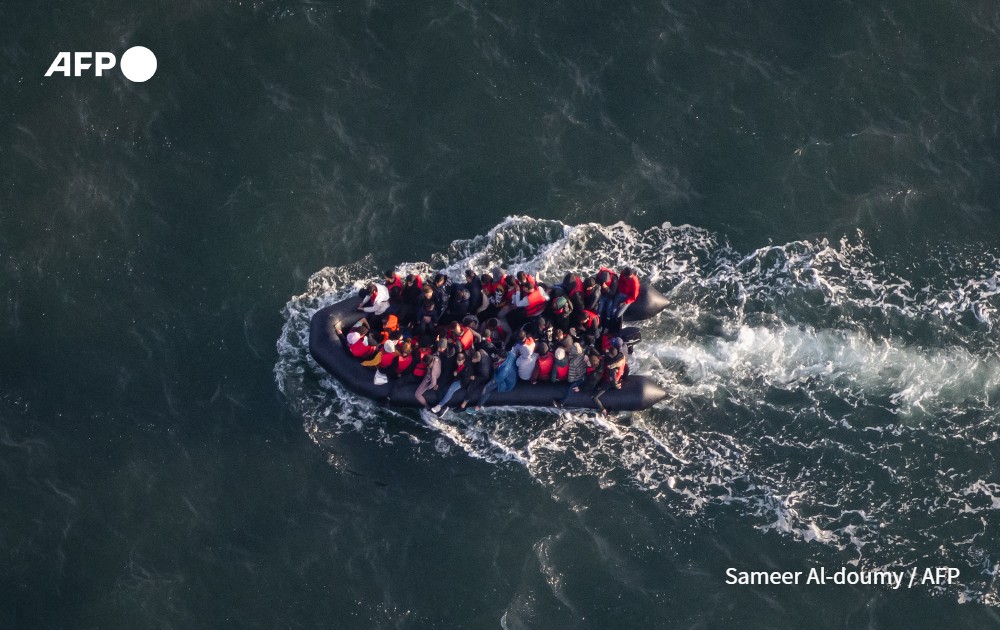 aerial picture shows migrants onboard of a dinghy