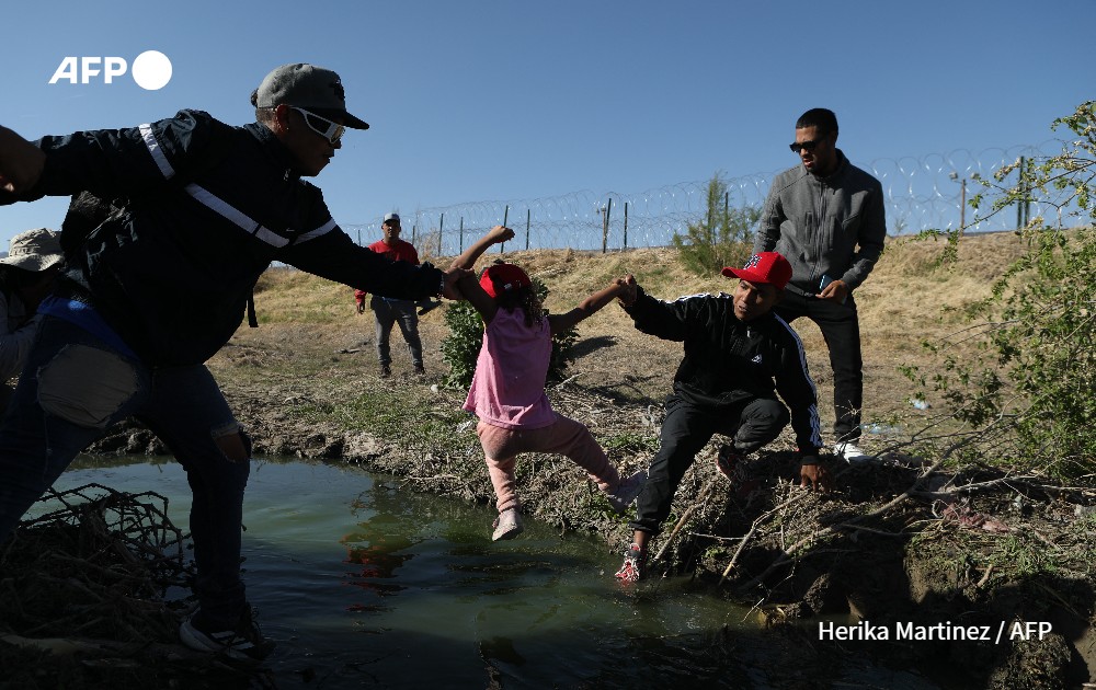 Migrants cross the Bravo river, Mexican side