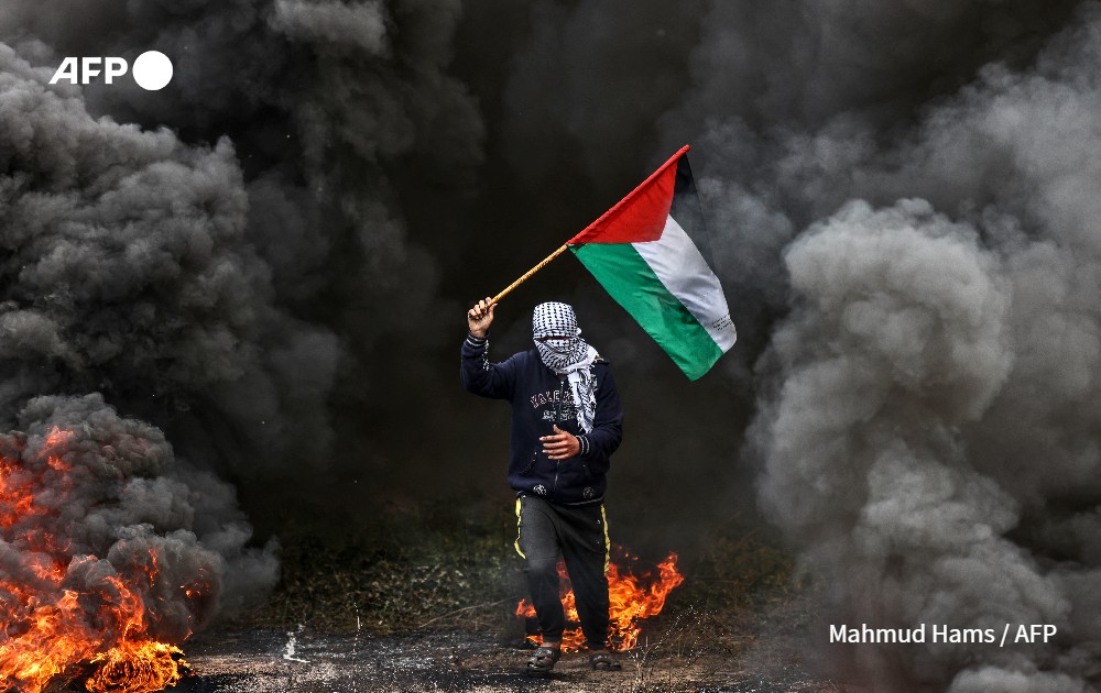 palestinian youth during protest near Israel-Gaza border 