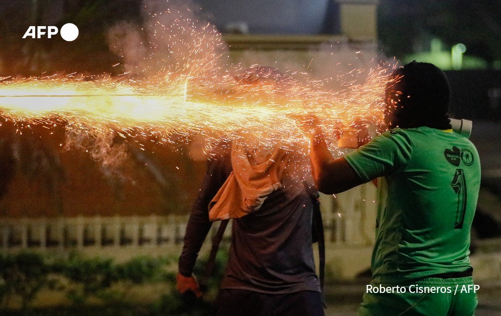 Demonstrators clash with riot police during a protest