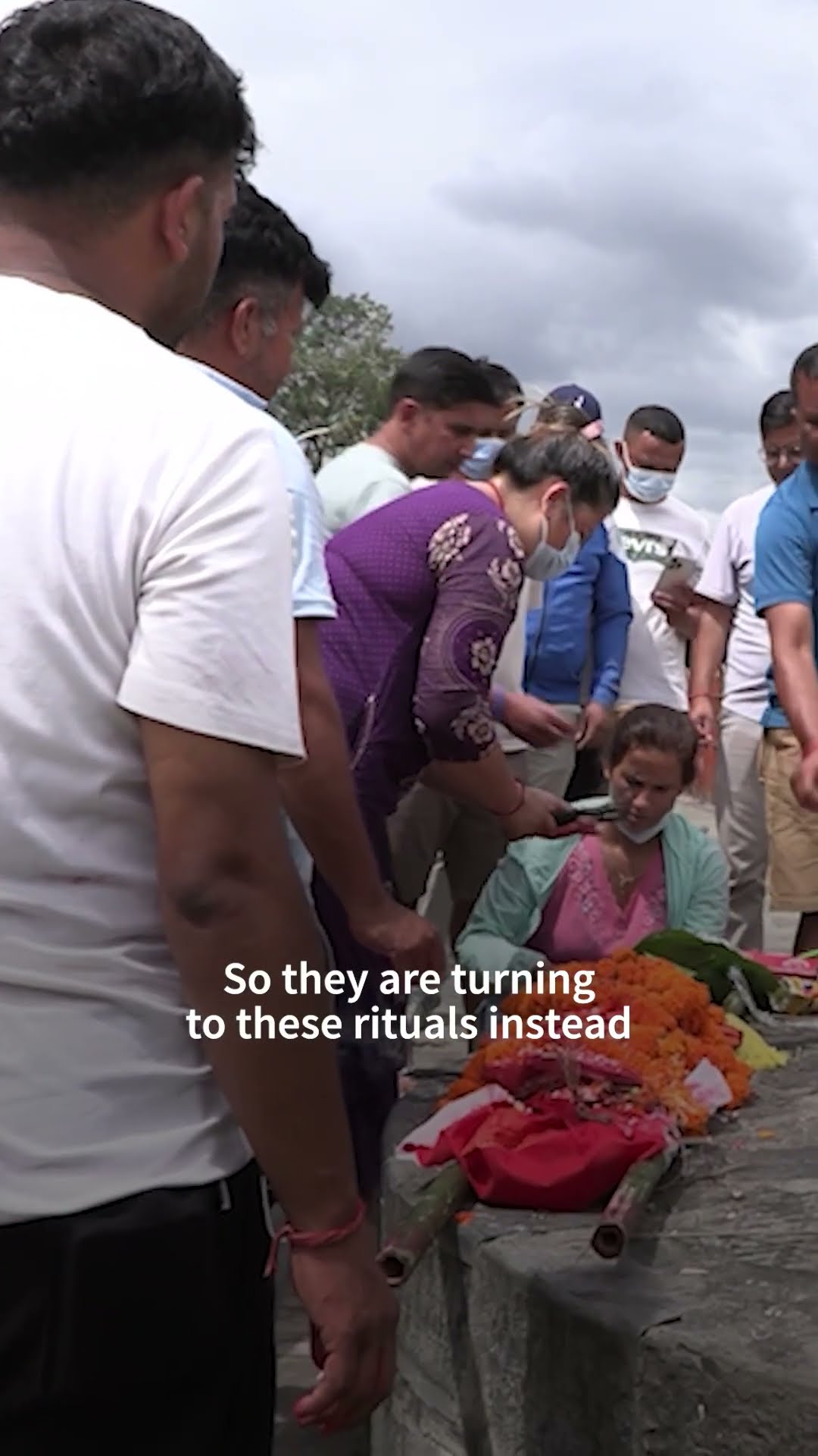 Nepali families hold symbolic funerals for missing after floods | AFP