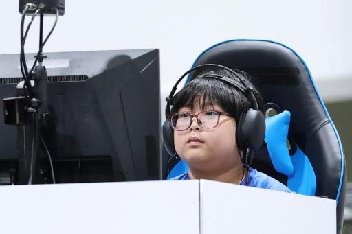 Japan schoolboy, 11, wins gold while empty seats blight Asian Games