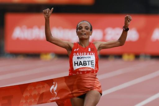 Bahrain's Shitaye Habte crosses the finish line to win gold in the women's marathon — DAVID GRAY / AFP
