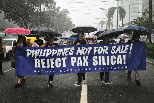 People march as they protest against Pax Silica, a US-led initiative, in Manila on August 13, 2026 — Jam STA ROSA / AFP