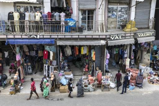 Shops and street vendors sell wares in downtown Dakar in September 2026 — PATRICK MEINHARDT / AFP