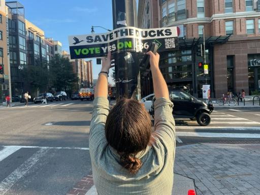Mike Accardi, a volunteer with the animal rights group Pro Animal DC, which says the process of making foie gras in cruel as it involves force feeding ducks — Matthew PENNINGTON / AFP