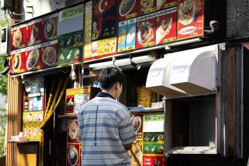 The new rules for permanent residency come after the ruling Liberal Democratic Party last year pushed to tighten regulations for business manager visas — Andrew CABALLERO-REYNOLDS / AFP