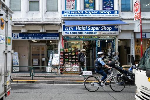 Under the regulations, the application fee for permanent residency will soar to 200,000 yen ($1,275) from the current 10,000 yen — Andrew CABALLERO-REYNOLDS / AFP
