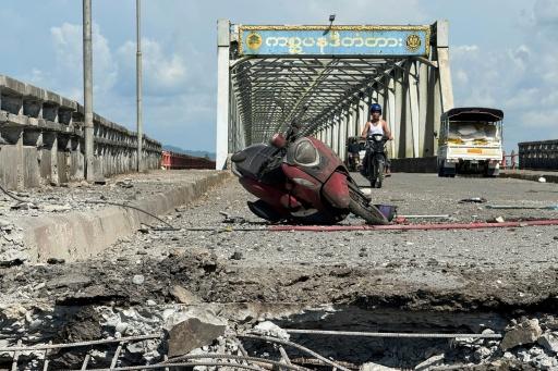 A damaged motorcycle on the Kisapanadi Bridge following Monday's military airstrike on Kyauktaw — - / AFP