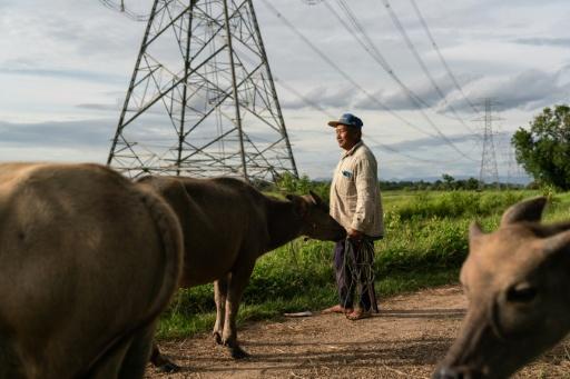 Laos's ageing grid struggles to keep pace with an increasingly modern economy of tourism, massive infrastructure, urban development and air conditioning — - / AFP