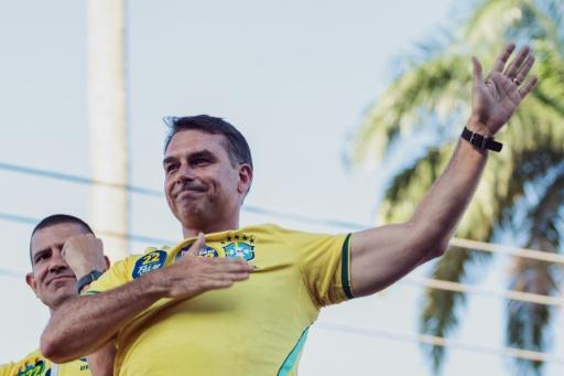 Brazilian right-wing presidential candidate Flavio Bolsonaro has styled himself as a 'more moderate' version of his firebrand father, while relying heavily on his enduring political appeal — Douglas SHINEIDR / AFP