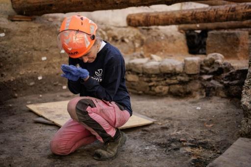 The wall, uncovered in the course of excavations beneath the Hotel-Dieu hospital, also bears traces of fire — Simon WOHLFAHRT / AFP