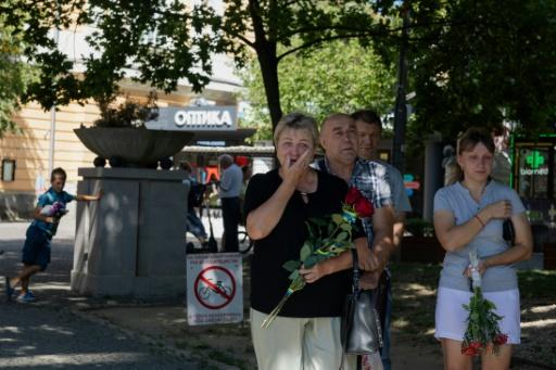 A smell of incense filled the air as priests sang a prayer for the souls of the fallen — Tetiana DZHAFAROVA / AFP