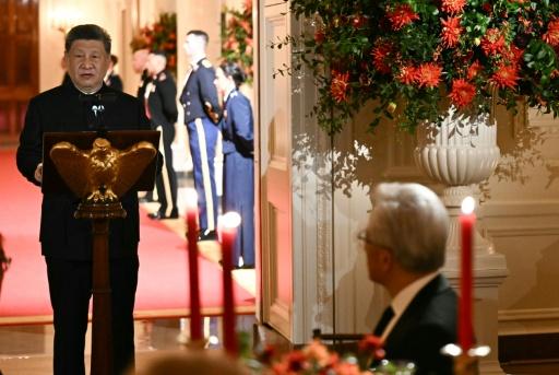 President and CEO of NVIDIA Jensen Huang (R) listens to China's President Xi Jinping speak during a State Dinner in the East Room of the White House in Washington, DC, on September 24, 2026 — Brendan SMIALOWSKI / AFP