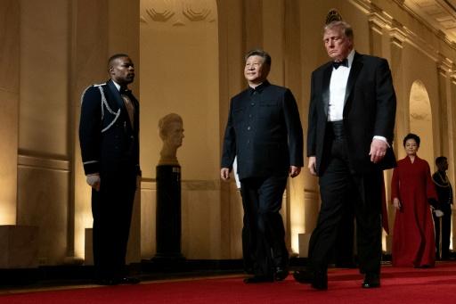 US President Donald Trump and China's President Xi Jinping arrive for a State Dinner in the East Room of the White House — Brendan Smialowski / AFP
