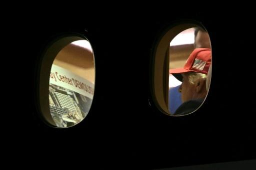 AFP photo shows Trump examining image of Kennedy Center apparent demolition