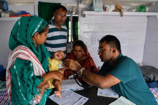 The network of mobile 'hope' boat clinics brings doctors, medicines and vaccines to 13 districts in India's Assam state — Biju BORO / AFP