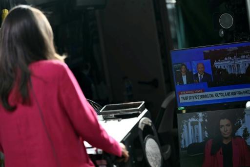 CNN Senior White House Correspondent Kristen Holmes waits to appear on-air from the CNN position on Pebble Beach, where television networks broadcast from the North Lawn of the White House — Kent NISHIMURA / AFP