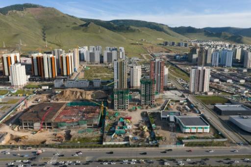 The cable car line will soar over a major thoroughfare, as well as the wide Tuul River floodplain and the Trans-Mongolian Railway but residents say more will be needed to combat pollution and traffic — Hector RETAMAL / AFP