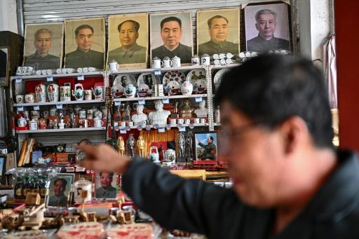 Dazhai is overflowing with shops selling items that support Mao's personality cult -- posters, playing cards, and crockery emblazoned with his image — Pedro PARDO / AFP