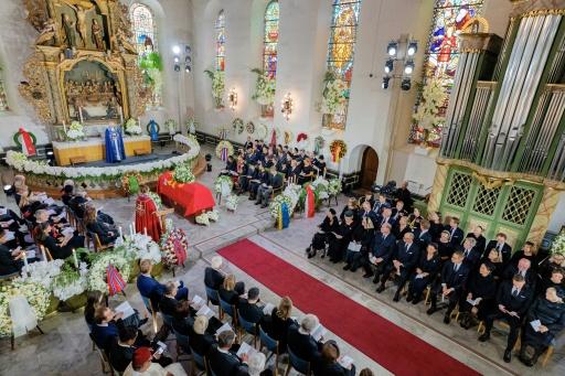 Le cercueil du roi Harald V de Norvège dans la cathédrale d'Oslo, ainsi que la  famille royale et les invités pendant la cérémonie funèbre, le 9 septembre 2026 — Stian Lysberg SOLUM / AFP