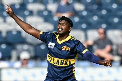 Sri Lanka's Sachindu Colombage celebrates after dismissing England's Joe Root during the 1st ODI at the Riverside Ground — Paul ELLIS / AFP