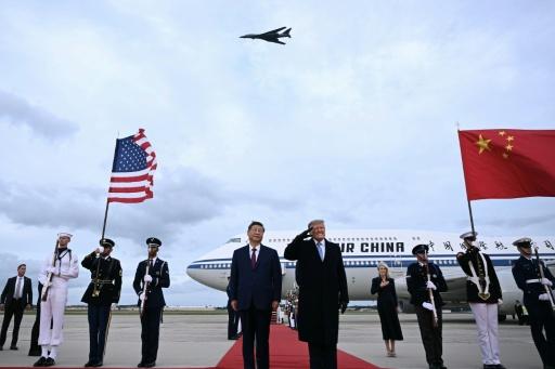 US President Donald Trump grimaced as B-1 bombers staged a noisy flyover — Brendan SMIALOWSKI / AFP