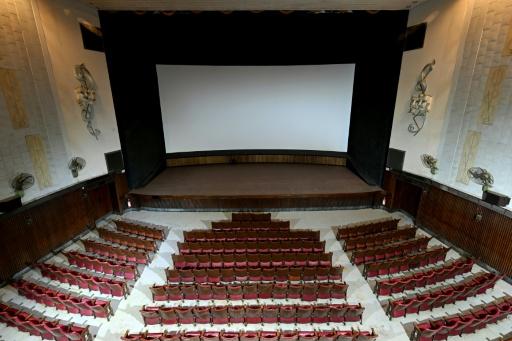 Many of India's old film halls could accommodate around 1,000 people, creating a communal atmosphere rarely found in today's multiplexes — Punit PARANJPE / AFP