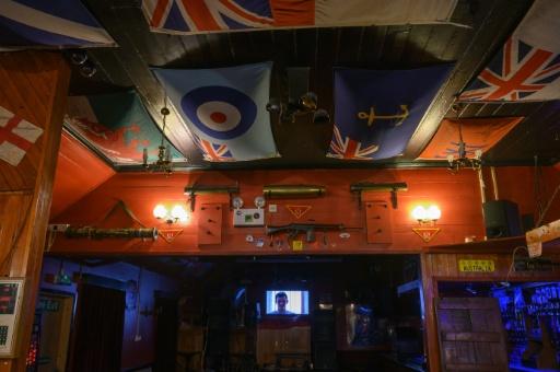 War memorabilia from the 1982 Falkland War's battle fields is displayed at The Globe Tavern pub in Stanley, Falkland Islands — Pablo PORCIUNCULA BRUNE / AFP