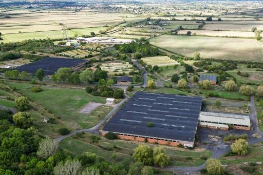 This aerial image shows a former military base where the government has proposed housing some 1,200 asylum seekers — JUSTIN TALLIS / AFP