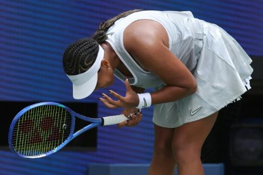 Osaka squeezes into US Open third round