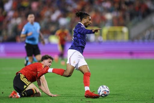 Michael Olise leaves the Belgian defence behind on his way to scoring France's winner — FRANCK FIFE / AFP