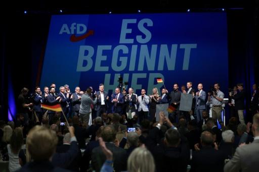 'It Begins Here' reads an AfD slogan at the election party of the far-right group — Ronny HARTMANN / AFP