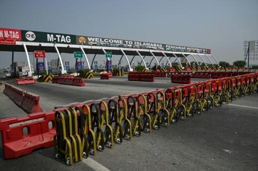 A general view shows the Islamabad–Peshawar Motorway blocked with trucks placed by authorities in Islamabad on September 24, 2026, ahead of opposition party Pakistan Tehreek-e-Insaf (PTI) protest demanding the release of former Prime Minister Imran Khan. — Aamir QURESHI / AFP