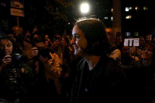 Russia slaps curfew on charity director over army criticism
