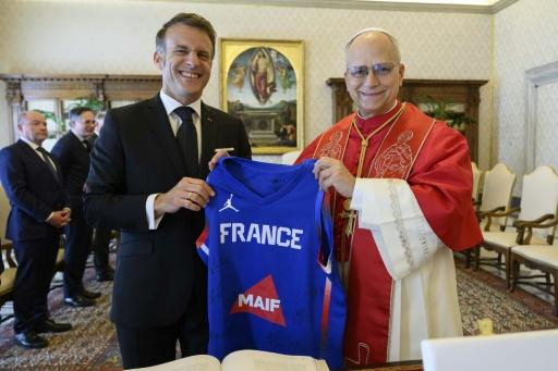 Macron in April gave the pope an autographed France basketball jersey — Simone Risoluti / AFP