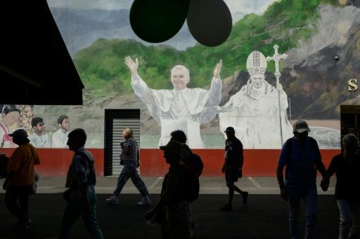 A fresco of former popes in Lourdes — Ed JONES / AFP