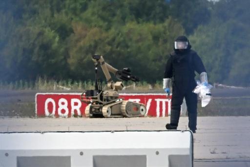 A bomb-disposal robot was used after an explosives-laden drone was found near a plane overnight in Leipzig — Hendrik Schmidt / AFP