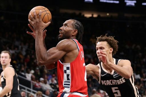 Kawhi Leonard, shown driving to the basket while playing for the Los Angeles Clippers, was fined $700,000 by the NBA for his part in salary cap violations involving the team — Kevin C. Cox