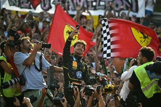 Charles Leclerc takes a selfie with Ferrari fans after winning the Italian Grand Prix at Monza in 2024 — Gabriel BOUYS / AFP