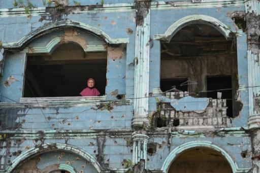 Soraya Tambo's house still bears the scars of war — Ted ALJIBE / AFP