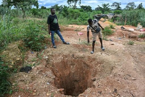 Prospectors leave gaping holes in the ground after illegally digging for gold — Issouf SANOGO / AFP